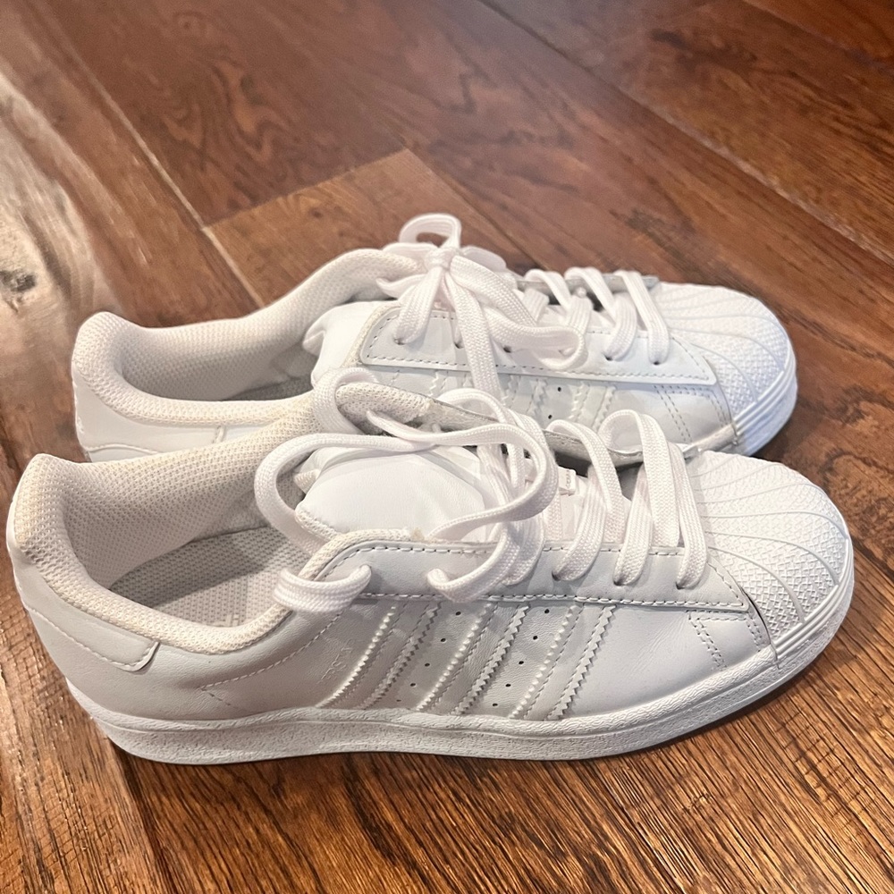 All white shell top adidas sneakers